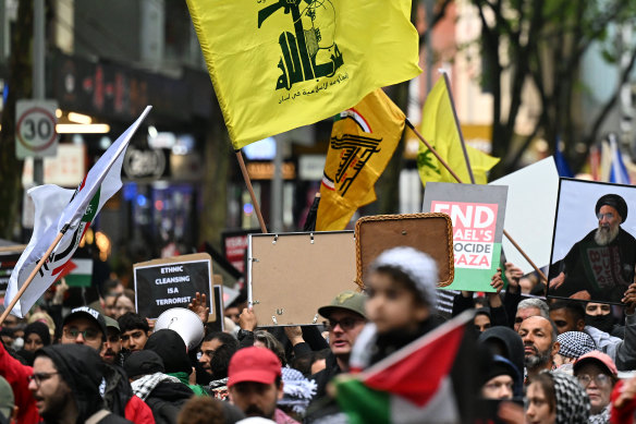 A Hezbollah flag can be seen at the pro-Palestine rally outside the State Library of Victoria on Sunday.